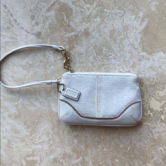 Coach Handbags - Coach White Limited Ed Canvas wristlet gold trim